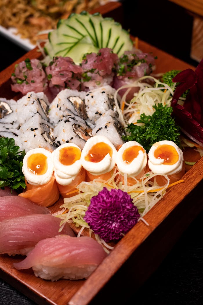 Elegant sushi platter with rolls and sashimi, perfect for gourmet food lovers.